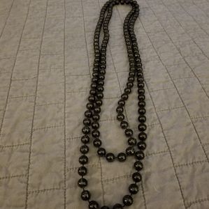 Long black pearl necklace